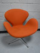 A Fritz Hansen designer chair upholstered in orange fabric CONDITION REPORT: Fabric
