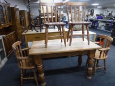 A pine kitchen table together with four chairs (two carvers and two singles)