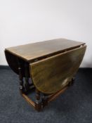 An oak drop leaf coffee table