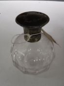 A sterling silver lidded perfume bottle