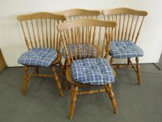 A set of four pine kitchen chairs