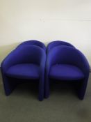 A set of four blue office reception tub chairs