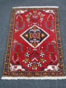 A Persian design rug,