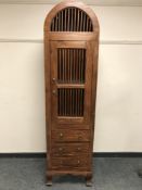 A contemporary hardwood domed cabinet,