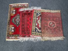 Four fringed Eastern prayer rugs