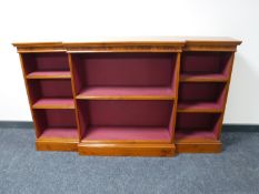 A set of yew wood break front bookshelves