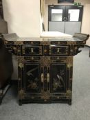 An Oriental lacquered and gilt altar cabinet,