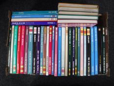 A box containing Haynes car manuals, Volvo,