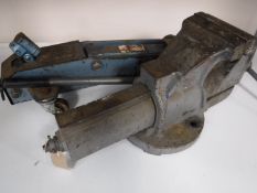 A heavy duty bench vice together with a car jack