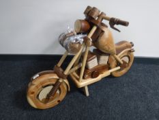 A wooden model of a motorcycle,