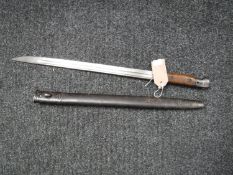 A 1907 pattern Wilkinson bayonet in scabbard