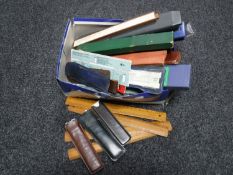 A box of large quantity of vintage slide rules and rulers