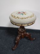 A Victorian mahogany tapestry upholstered tripod stool