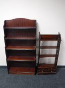 A set of narrow mahogany open bookshelves, fitted four drawers,