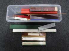 A box of large quantity of vintage slide rules and rulers
