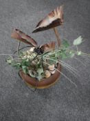 A water feature in the form of a pot plant