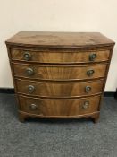 A mahogany bowfront chest of four drawers,