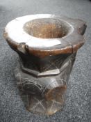 A carved hardwood tribal vessel