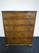 A walnut five drawer chest