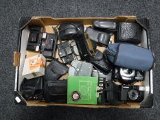 A box of various cameras including Pentax, Lomo,