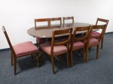 Eight Victorian oak dining chairs and a Regency style dining table with leaf