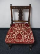 A late Victorian carved walnut bedroom chair