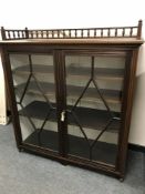A Victorian glazed mahogany bookcase with gallery top,