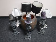 A set of three ornate candle holders with candles together with a pottery planter and two pairs of