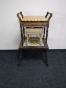 An Edwardian piano stool,