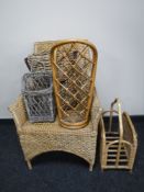 A wicker armchair, wicker and bamboo mag rack, stick stand,