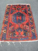 An Iranian Hamadan rug on blue ground
