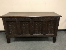 A George III and later carved oak blanket chest,