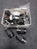 A collection of camera lenses including Miranda, Petri, Mamiya etc, together with a Hanimex flash.