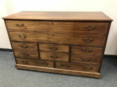 A George III inlaid mahogany chest of drawers,