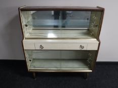 A mid twentieth century melamine display cabinet