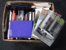 A box of assorted car manuals,