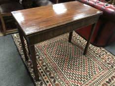 A George III mahogany turnover top tea table,