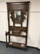 A Victorian carved oak mirror back hall stand