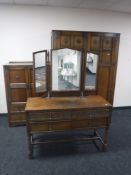 A three piece carved oak Lawrencia Furniture bedroom suite