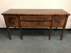 A late Victorian inlaid mahogany breakfront sideboard,
