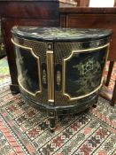 An Oriental lacquered and gilt bowfront cabinet,