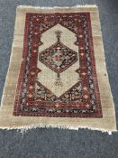 An antique Serapi rug,