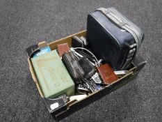 A box of various camera accessories.