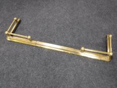 An antique brass fender