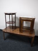 A nest of three mahogany tiled topped tables depicting Dutch scenes,