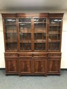 A reproduction mahogany breakfront sideboard,