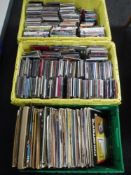 Three crates of assorted vinyl LP records, DVD's,