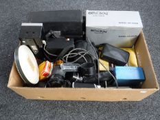 A box containing assorted camera equipment and accessories,