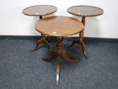 Three mahogany wine tables on three way pedestals