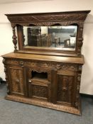 A Victorian green man carved oak mirror back sideboard,